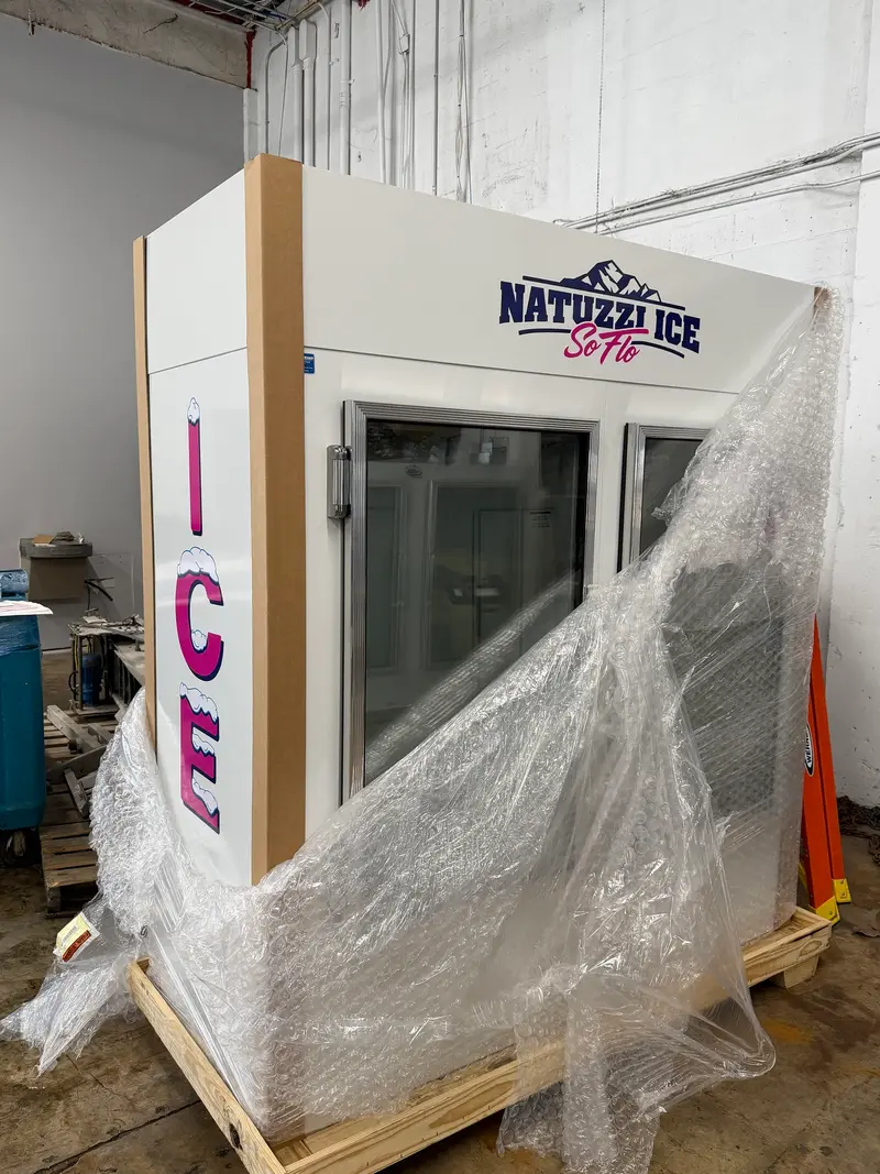 Glass-door ice merchandiser with Natuzzi Ice SoFlo branding