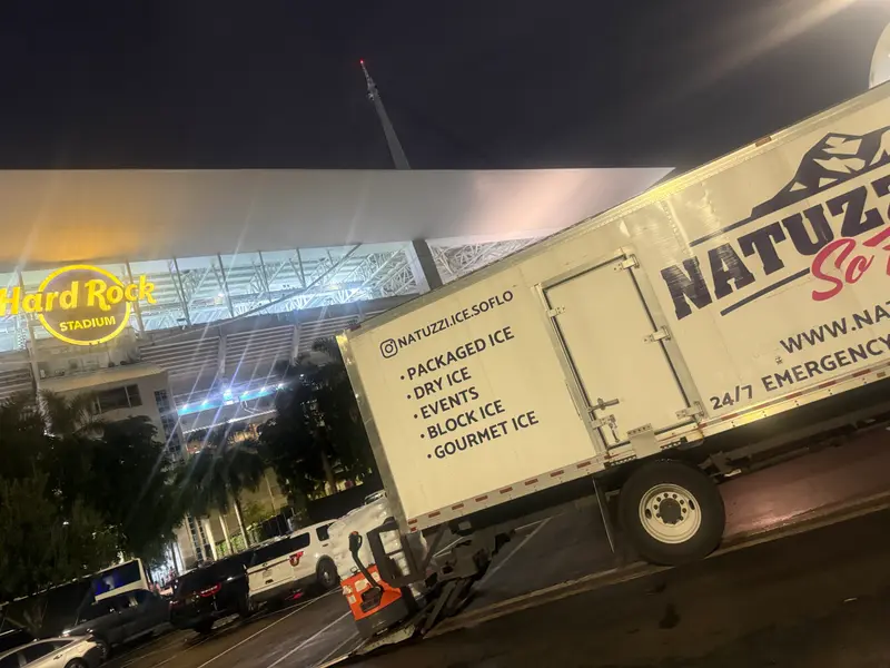 Natuzzi Ice SoFlo truck unloading at Hard Rock Stadium at night