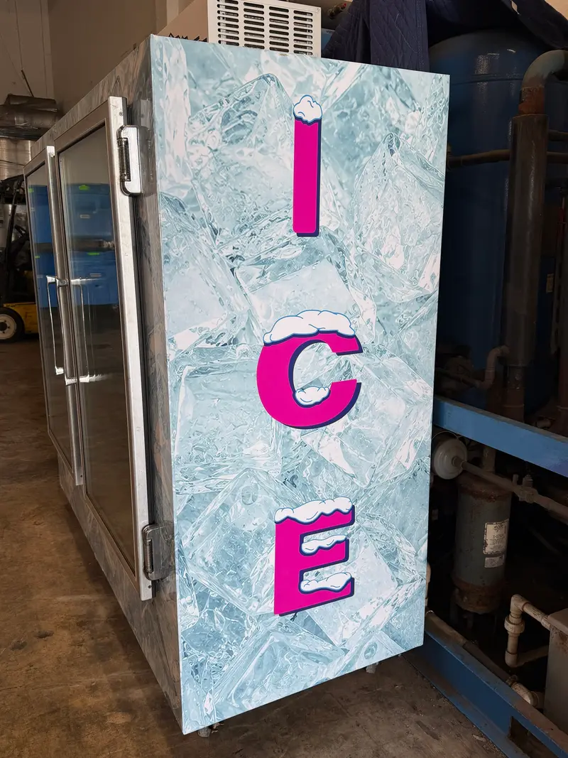Side of a Natuzzi Ice SoFlo merchandiser: big pink ICE letters with snow caps over an ice-cube wrap